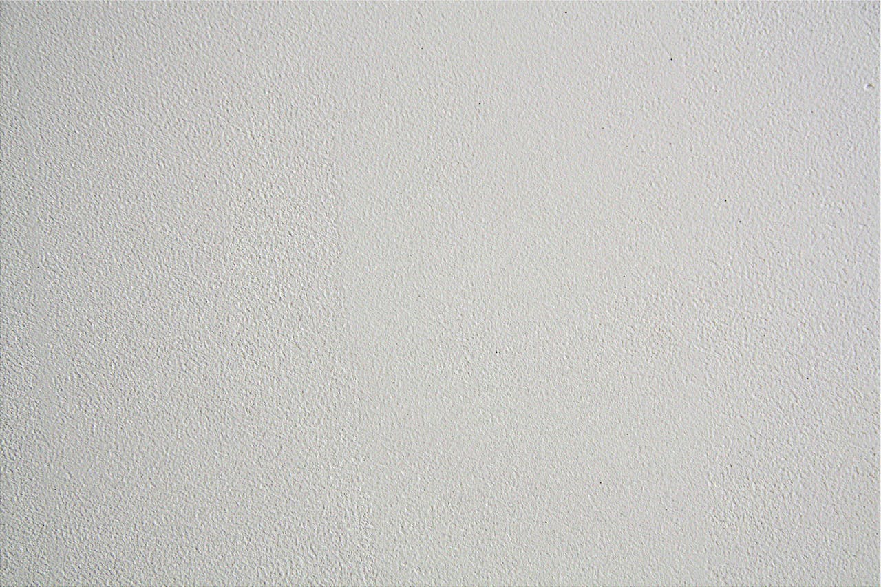 a window lets in light on a painted wall