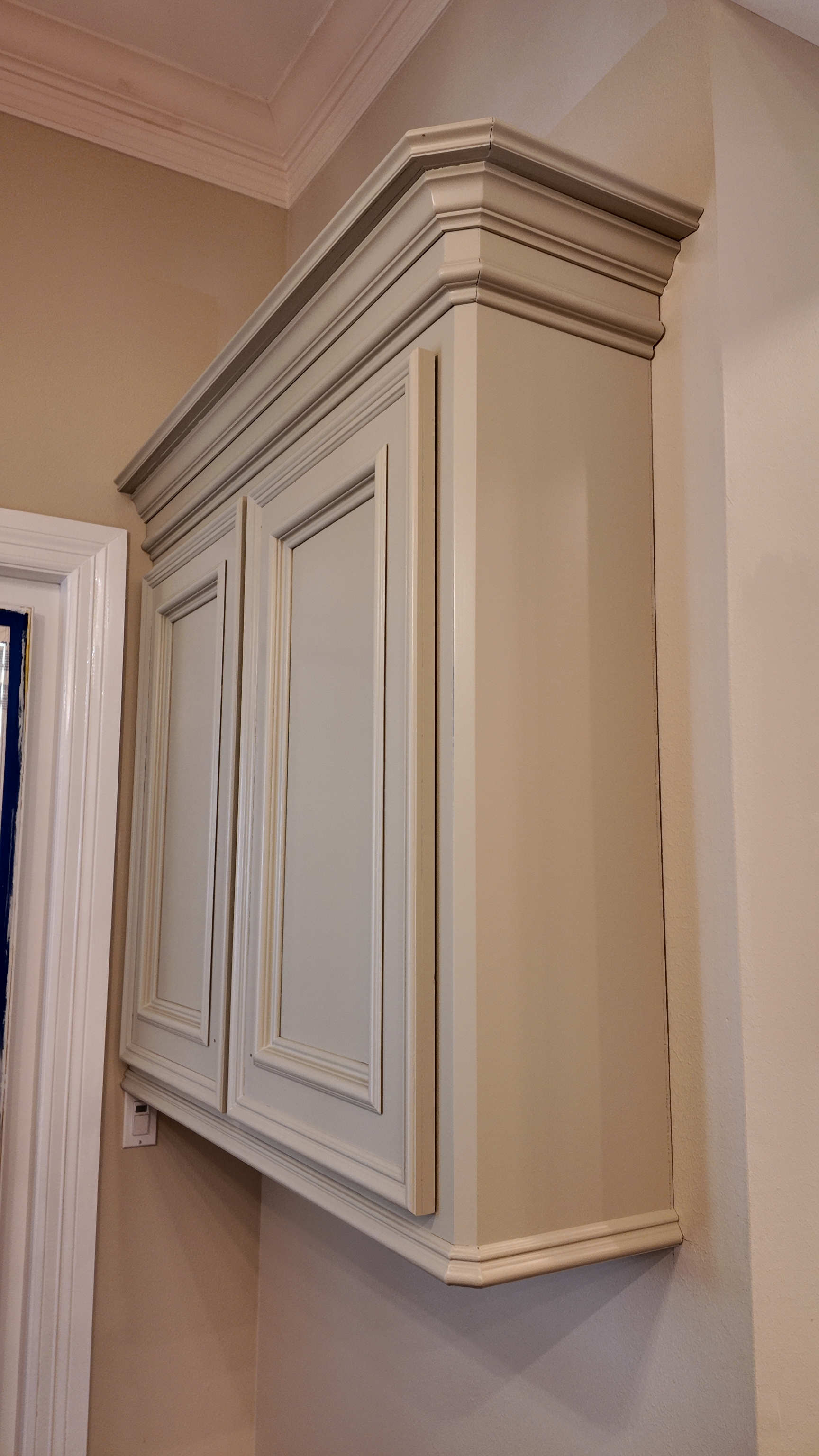 Checking a paint sample on a small piece of wood